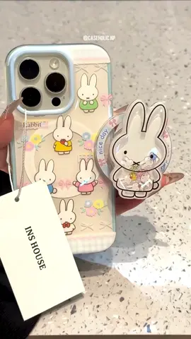 A Soft, Pastel Design Phone Case With Cute Cartoon Bunny Characters That Add A Playful And Cheerful Touch. Made From High-Quality TPU Material, It Provides Strong Protection Against Drops, Scratches, And Everyday Wear. The Case Includes A Matching 3D Bunny Pop Socket For Better Grip And Stand Functionality, Making It Both Stylish And Practical. With Its Smooth Edges And Glossy Finish, It’s Perfect For Anyone Who Loves Cute And Aesthetic Accessories. Available for all models From iPhone 14 to 17 Pro Max  Dm us for details and enquiries #phonecase #mobilecover #phonecover #caseholic #nepal