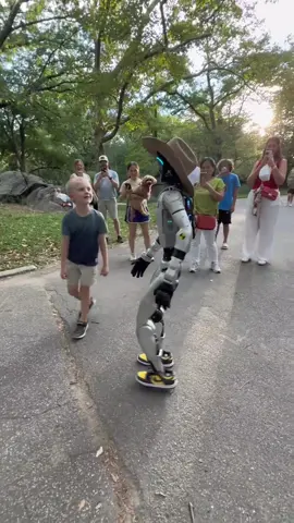 Robot shakes hands with a kid