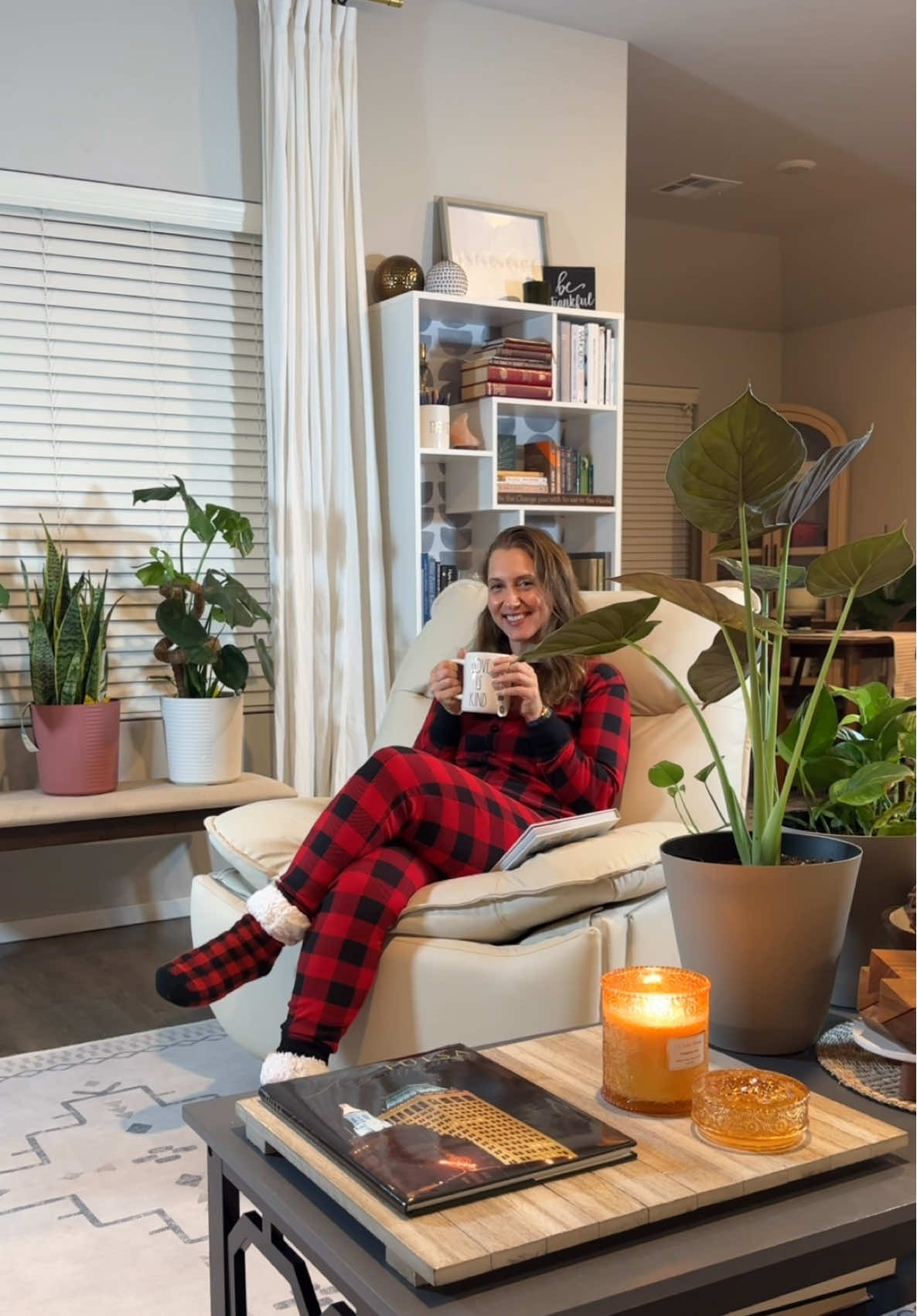 Tell me you love buffalo plaid without telling me you love buffalo plaid... I'll go first ❤️🖤 Cocooning has officially become my favorite self-care ritual, and these @Little Blue House buffalo plaid cozies are the MVP of my favorite season. The second I slip into them, it's like my body gets the memo: time to SLOW DOWN. My go to cocooning routine? Light a candle, brew some tea, grab a great book, and sink into my recliner for pure uninterrupted peace. No notifications. No to-do lists. Just me, my book, some winter candle scents wafting about, and of course the coziest pajamas that feel like an actual warm hug 🕯️📖 Here's the thing I'm learning this season: self-care isn't selfish—it's essential. When I give myself permission to rest and recharge, I show up as my best self for everyone I love. And honestly? It all starts with creating your own little sanctuary. So if you need me, I'll be in my cozy corner, wrapped in buffalo plaid, living my best cocooning life 🛋️✨ What does YOUR ideal self-care evening look like? Spill it bestie!👇 #LittleBlueHouse #Cocooning #SelfCareRoutine #BuffaloPlaid #CozyVibes       