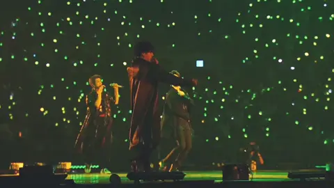 “Jimin & ARMY — A Dance We Never End” He steps into the music, and the world leans closer. Every move, a line of poetry written in air, meant for us — only for us. Under the lights, he finds us, eyes pulling us in like gravity with a heartbeat. And for a moment — it’s not a concert. It’s a promise. ARMY cheers, he smiles — we rise, he glows.. It’s a promise. ARMY