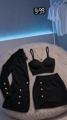 Elegant black three-piece outfit with gold button accents exuding classy and modern vibes. #ChicStyle #ElegantLook #BlackOutfit #FashionVibes #ClassyMood