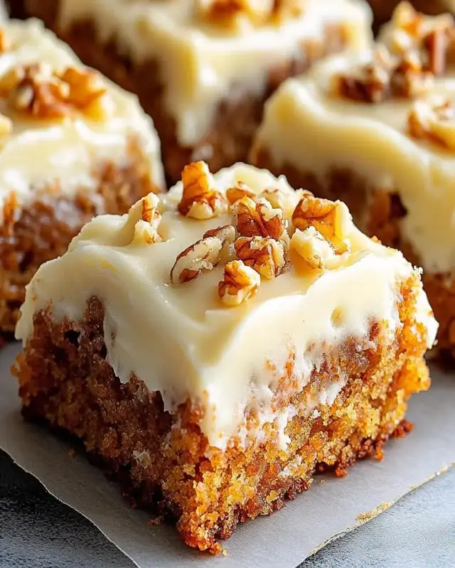 Decadent Carrot Cake Bars with Cream Cheese Frosting Ingredients: - 2 cups all-purpose flour - 1 1/2 teaspoons baking powder - 1 teaspoon baking soda - 1/2 teaspoon salt - 1 teaspoon ground cinnamon - 1/2 teaspoon ground nutmeg - 1/2 teaspoon ground ginger - 1/2 cup unsalted butter, softened - 1 cup granulated sugar - 1/2 cup brown sugar - 3 large eggs - 1 teaspoon vanilla extract - 2 cups grated carrots - 1/2 cup crushed pineapple, drained - 1/2 cup chopped walnuts (optional) Cream Cheese Frosting: - 8 oz cream cheese, softened - 1/4 cup unsalted butter, softened - 2 cups powdered sugar - 1 teaspoon vanilla extract Directions: 1. Preheat your oven to 350°F (175°C) and grease a 9x13 inch baking pan. 2. In a bowl, whisk together the flour, baking powder, baking soda, salt, cinnamon, nutmeg, and ginger. 3. In a large mixing bowl, cream together the softened butter, granulated sugar, and brown sugar until light and fluffy. 4. Add the eggs one at a time, mixing well after each addition, then stir in the vanilla extract. 5. Gradually add the dry ingredients to the wet mixture, mixing until just combined. 6. Fold in the grated carrots, crushed pineapple, and walnuts (if using). 7. Pour the batter into the prepared baking pan and spread evenly. 8. Bake for 25-30 minutes, or until a toothpick inserted in the center comes out clean. Allow to cool completely. For the Cream Cheese Frosting: 1. In a mixing bowl, beat together the softened cream cheese and butter until smooth. 2. Gradually add the powdered sugar and vanilla extract, mixing until creamy and well combined. 3. Spread the frosting over the cooled carrot cake bars and cut into squares to serve. Prep Time: 20 minutes | Cooking Time: 30 minutes | Total Time: 50 minutes Servings: 12 servings | Kcal: 350 kcal per serving Enjoy! #california #kitchen #cookies #cake #Love 