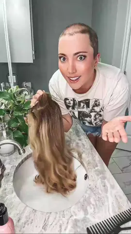 When your human hair wig feels more like straw than silk, it’s time for a deep hydration rescue. 💧 Here’s my routine: 🪞 Lay the wig flat on the counter (less tangling this way!) 🧴 Gently work deep conditioner through the hair only - never on the knots, because conditioner can loosen them over time. ⏳ Let it soak for however long your heart desires. Usually 10–20 min. 🚿 Rinse, air dry, and admire the softness. I do this every couple of months (or whenever my wig feels dry) to keep the hair healthy and hydrated. This is especially important if you live in dry climates or with winter weather coming! Your wig will be DRY! 💡 Why it matters: Human hair wigs don’t get natural oils from a scalp, so without proper hydration, they can get brittle and break faster. Between washes, I’ll also smooth on a hair oil to lock in moisture! #WigDeepConditioning #WigMaintenanceTutorial #RestoreYourWig #DryWigFix #HumanHairWigs