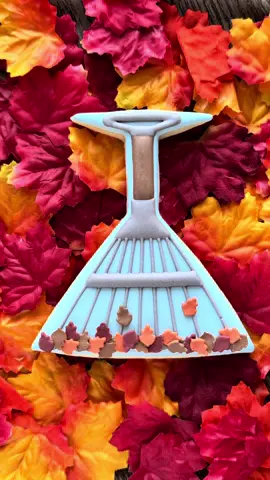 Happy Flippin’ Friday! It’s the day of the week when I share a cookie cutter “flip” by decorating a cookie as something unexpected.  This week, a martini into a rake. There has been a nip in the air most mornings here in San Antonio, which is pretty much fall for us, so I get to enjoy wearing a cute sweater from about 6am-10am. 😁 I used a sprinkle swipe from my 2024 Cookie Con swag bag to make the leaf sprinkles.  #cookies #cookiedecorating #cookiedecoratingvideos #autumn #leaves 