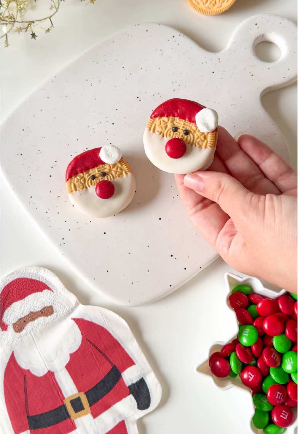 Easy Santa Cookies🎅🏼✨ What you will need: * cookies (I used Oreos) * White chocolate  * Red Candy melts (also known as waffers or dye white chocolate red)  * Black icing (could also use milk chocolate  * Chocolate candy (I used M&M’s) * Mini marshmallows Follow along for more holiday and treat inspo!✨🎄  #christmas2025 #🎄 #christmastok #holidaytiktok #holidayvibes #christmasvibes #santa #cookies  Christmas treats, Christmas ideas, Christmas inspiration, Christmas food, Christmas charcuterie, Christmas party ideas, Christmas snacks