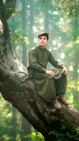 Trading image Gemini prompt 👇👇👇  Ultra-realistic 8K cinematic portrait of a stylish young Pakistani man sitting calmly on a giant tree deep inside a lush green forest of northern Pakistan. Sunlight filters softly through dense deodar and pine leaves, with a gentle mist in the air creating a peaceful yet mysterious atmosphere. He is wearing a traditional Pakistani shalwar kameez in an elegant, natural fabric - neat and slightly flowing in the forest breeze - looking thoughtful and confident. Detailed bark and leaf textures, natural film color tone, depth of field, HDR lighting, and realistic shadows. Face, hair, and beard must remain 100% original and identical to the reference image - no edits or changes #foryoupage #dontunderreviewmyvideo #gimini #sportsontiktok #viralvideo 