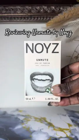 Reviewing Unmute by Noyz – unisex Smells like: A warm, spicy gourmand that balances sweetness with smoky incense vibes.  Cinnamon and plum hit first, the pistachio adds a subtle nutty twist, and a smoky incense heart leads to a creamy vanilla-amber base. Cozy yet sophisticated, perfect for cooler evenings or when you want to make a statement without shouting. Notes: 	•	Top: Ceylon Cinnamon, Plum, Pistachio, Clary Sage, Cassia 	•	Middle: Incense 	•	Base: Madagascar Vanilla, Amber #UnmuteByNoyz #NoyzPerfume #UnisexFragrance #GourmandPerfume #VanillaAmber      