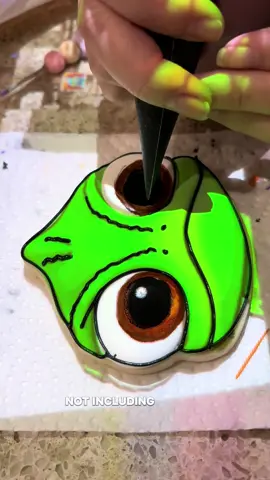 Bringing Pascal to life one cookie at a time. Tiny details make the magic in Tangled themed sets. cookiedecorating #royalicingcookies #decoratedcookies #cookietok #cookiedesign 