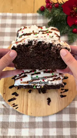 Hot Cocoa Banana Bread ☕️🍫 This is christmas in banana bread form 🎄✨ (Makes one 9x5 loaf pan) Ingredients: ½ cup (113g) unsalted butter, melted & slightly cooled  1 cup (200g) brown sugar, packed 2 eggs, room temp 1½ tsp vanilla extract 3 ripe bananas, mashed ¼ cup (60g) sour cream or greek yogurt, room temp  1¼ cups (160g) all-purpose flour ½ cup (50g) unsweetened cocoa powder ½ tsp cornstarch (optional) 1 tsp baking soda ½ tsp salt 1 cup (170g) semi-sweet chocolate chips  Topping: Marshmallow fluff Chocolate syrup Freeze dried or mini marshmallows  Christmas sprinkles  *tip: if you don’t want the marshmallow fluff to be as sweet, mix in a tiny bit of salt and vanilla to balance out the flavor and let it sit a few minutes before proceeding.  Instructions: Preheat oven to 350°F (175°C) and line/grease a 9x5 loaf pan. Whisk together the melted butter and brown sugar. Mix in eggs, vanilla, mashed bananas, and sour cream/greek yogurt until combined.  In a separate bowl, combine flour, cocoa powder, cornstarch, baking soda, and salt. Add dry ingredients to wet and mix until just combined. Don’t over mix. Fold in chocolate chips gently. Pour batter into the prepared loaf pan. Bake for 50-65 minutes or until a toothpick comes out clean/with a few moist crumbs. (Tent with foil for the last 10-15 minutes if the top is browning too much) Cool completely. Spread a thin layer of marshmallow fluff all over the top of the loaf (mix it a bit first so it’s easier to spread).  Drizzle with chocolate syrup and top with mini/freeze dried marshmallows and christmas sprinkles. Best eaten fresh! (the topping will just get a little messy over time)  such a cozy recipe for the holiday baking season ✨🎄 #bakingrecipe #bananabread #hotcocoa #christmas 
