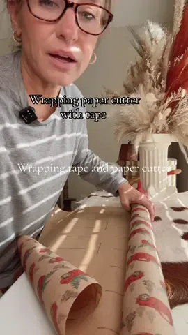 This wrapping paper cutter comes with extra cutting blades and a tape dispenser it cuts your wrapping paper super straight and smooth #wrappingpapercutter #giftwrapping #giftwrappinghack #wrapping #christmaswrapping 