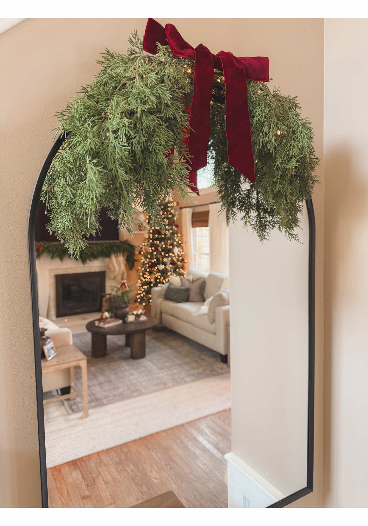 NEW AMAZON HOLIDAY FIND! 🌲✨ This little cedar swag with a velvet bow is battery-operated with warm fairy lights and the perfect cozy touch for an entryway, mirror, picture frame, sconce or range hood. A new holiday find that's simple, easy, and instantly festive. ♥️ Comment SHOP and I'll drop you the link! 🔗 #cozychristmas #holidaydecor #cedarswag #fairylights #homefortheholiday    Cozy Christmas | Holiday Decor | Cedar Swag | Fairy Lights | Home For the Holidays | Amazon Holiday Find | Simple Decor | Festive Feels