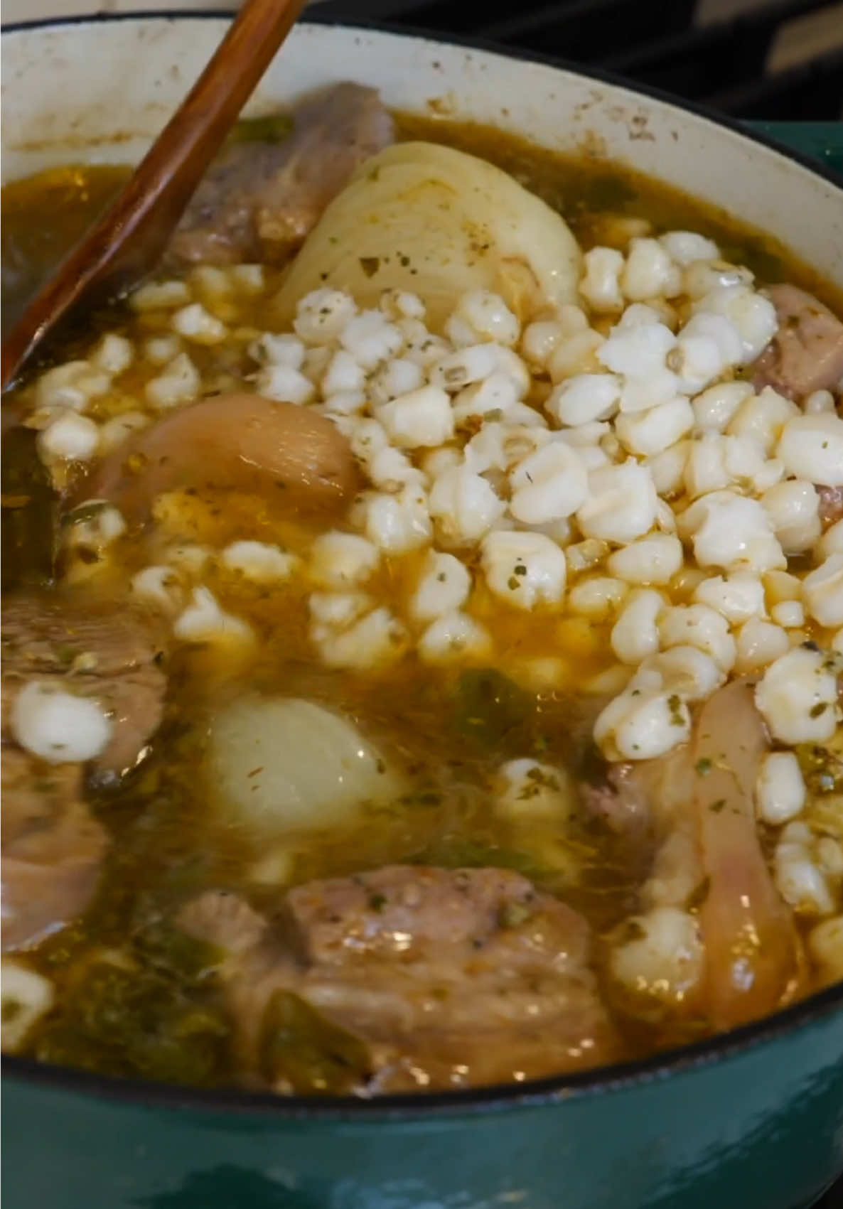 Chile verde pozole Ingredients 9 cups of water 1 tsp salt 3 pounds of pork butt 2 pounds of pork feet  1 onion 8 garlic cloves or half a garlic bulb  8 bay leaves 3 Tbsp chicken bouillon 1/2 Tbsp ground cumin 1/2 Tbsp black pepper 8 posted green chiles (or 4 (4oz) cans green chili  •	Roast 3 extra if you want to add at the end  5 cups pre-cooked hominy from a can  1 Tbsp Mexican oregano  For enhancing flavor, use 1 Tb #food #recipeoftheday #mexicanfood  #pozole #soup #food #EasyRecipe #cooking #viewsontheroad