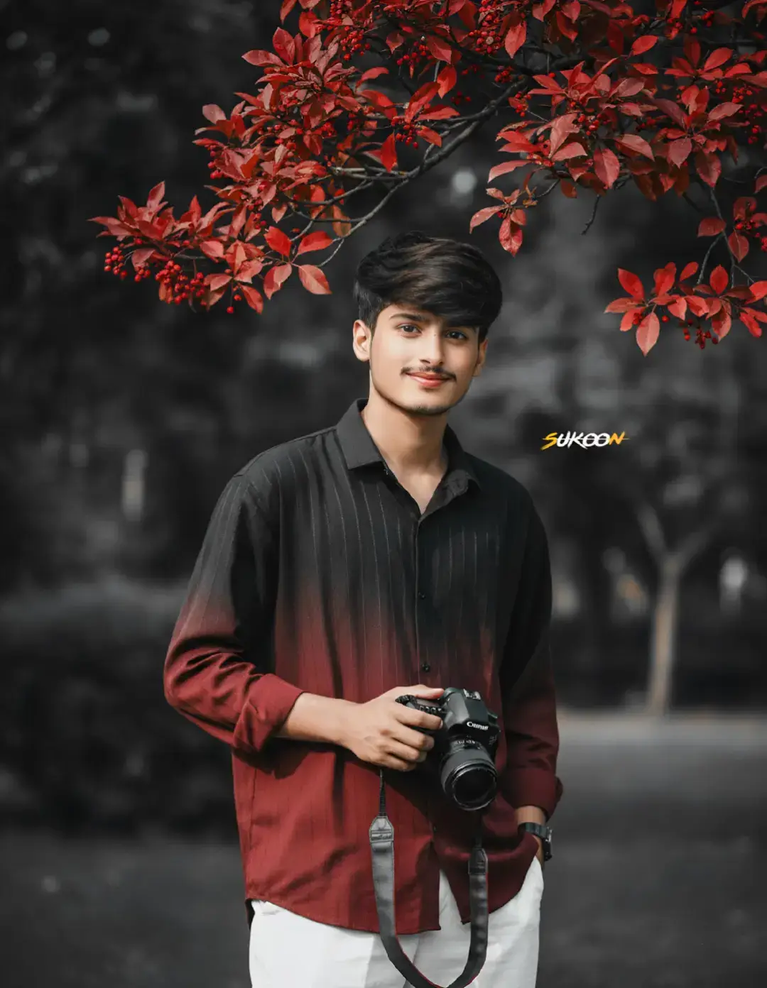 Creat a 8k hyper-realistic dark green portrait cinematic image with dramatic smile actions. (uploaded photo 100% face match) of A stylish handsome young man (refrence image given) with a slightly dark messy hairstyle and wearing a lose black & maroon gradient half lineing shirt and white lose pant. He hold a Canon camera, He is loking directly in camera, captured in a candid, high-key cinematic outdoor portrait The composition is framed by a branch of vivid red. #creatorsearchinsights2025 #creatortips #aiimages #aiprompt #photography @tiktok creators 