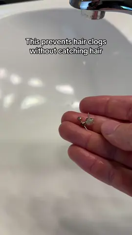 It catches jewlery and prevents hair clogs, but you don’t have to clean it out like a hair catcher and it doesn’t slow the flow rate of your sink. 