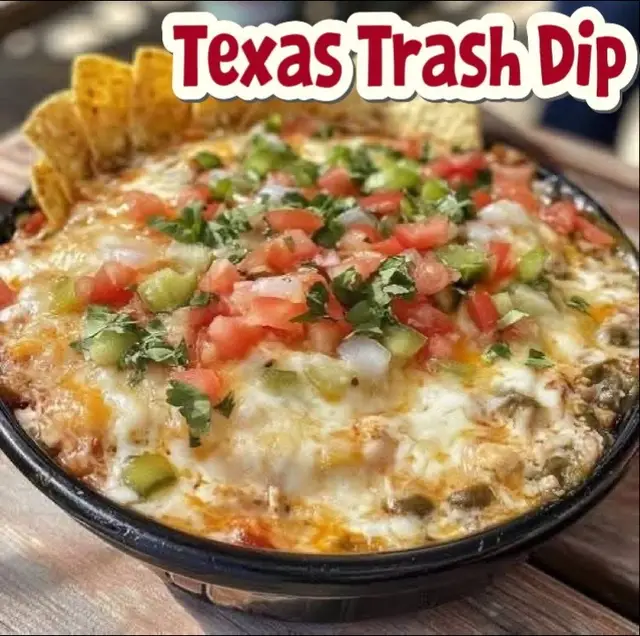 Ingredients: 	•	1 (8 oz) package cream cheese, softened 	•	1 cup sour cream 	•	1 (16 oz) can refried beans 	•	1 (1 oz) packet taco seasoning mix 	•	2 cups shredded Mexican blend cheese, divided 	•	1 cup shredded Pepper Jack cheese Instructions: 	1.	Preheat oven to 350°F (175°C). Lightly grease a medium baking dish (8x8 or similar). 	2.	Mix the base: In a large bowl, combine cream cheese, sour cream, refried beans, and taco seasoning. Stir until smooth and well blended. 	3.	Add cheese: Mix in 1 cup of the Mexican blend cheese and ½ cup of the Pepper Jack cheese. 	4.	Spread and top: Spread the mixture evenly into your prepared baking dish. Sprinkle the remaining cheeses evenly over the top. 	5.	Bake: Bake for 25–30 minutes, or until the dip is hot and bubbly and the cheese is melted and golden. 	6.	Optional garnish: Top with sliced green onions, diced tomatoes, olives, or jalapeños for extra flavor and color. 	7.	Serve warm with tortilla chips, corn chips, or fresh veggies. #​recipeideas #​appetizerrecipe #​ 📝 Recipe origin story: #fyp #footballfood #gamedayfood #gamedaysnacks  gamedaysnacks #​footballfoods #​foryourpage#Lemon8 