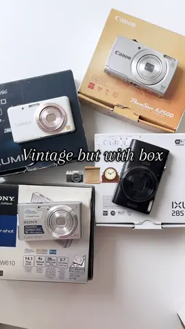 Vintage but boxed and beautiful 😚📦 Only a few left!! Available: Canon A2500 • Sony W610 • Lumix FX80 Sold: Canon 285HS • Ixy 2000is/690is • Nikon P6000 DM us to claim before they’re gone 💌⭐️ #fyp #vintagecamera #ccd #digitalcamera #khmertiktok  