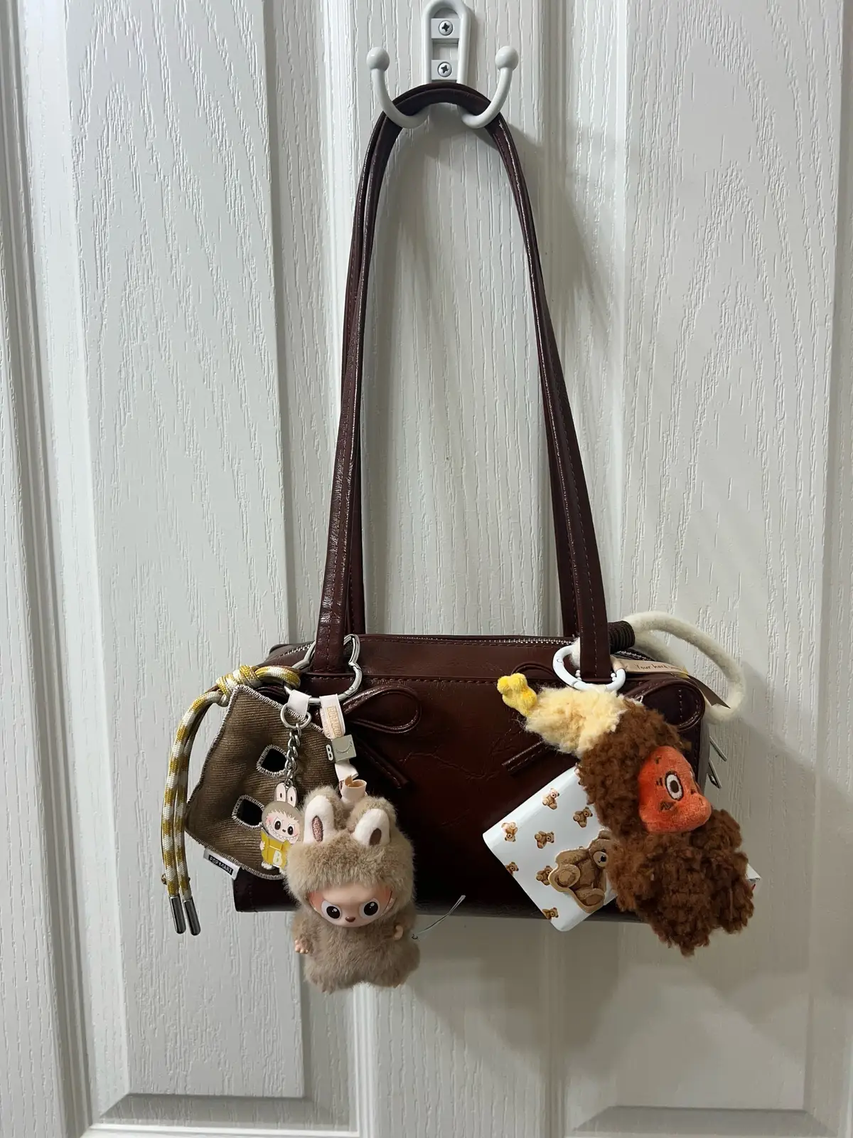 This bag is one of my favorites! I’ve shown it off before but this time I used some new plush pals to dress her up this time! I got this bag from Urban Outfitters and I’m obsessed! #​cutebags #​bagoftheday #​keychain #​popmart #​labubu#Lemon8 