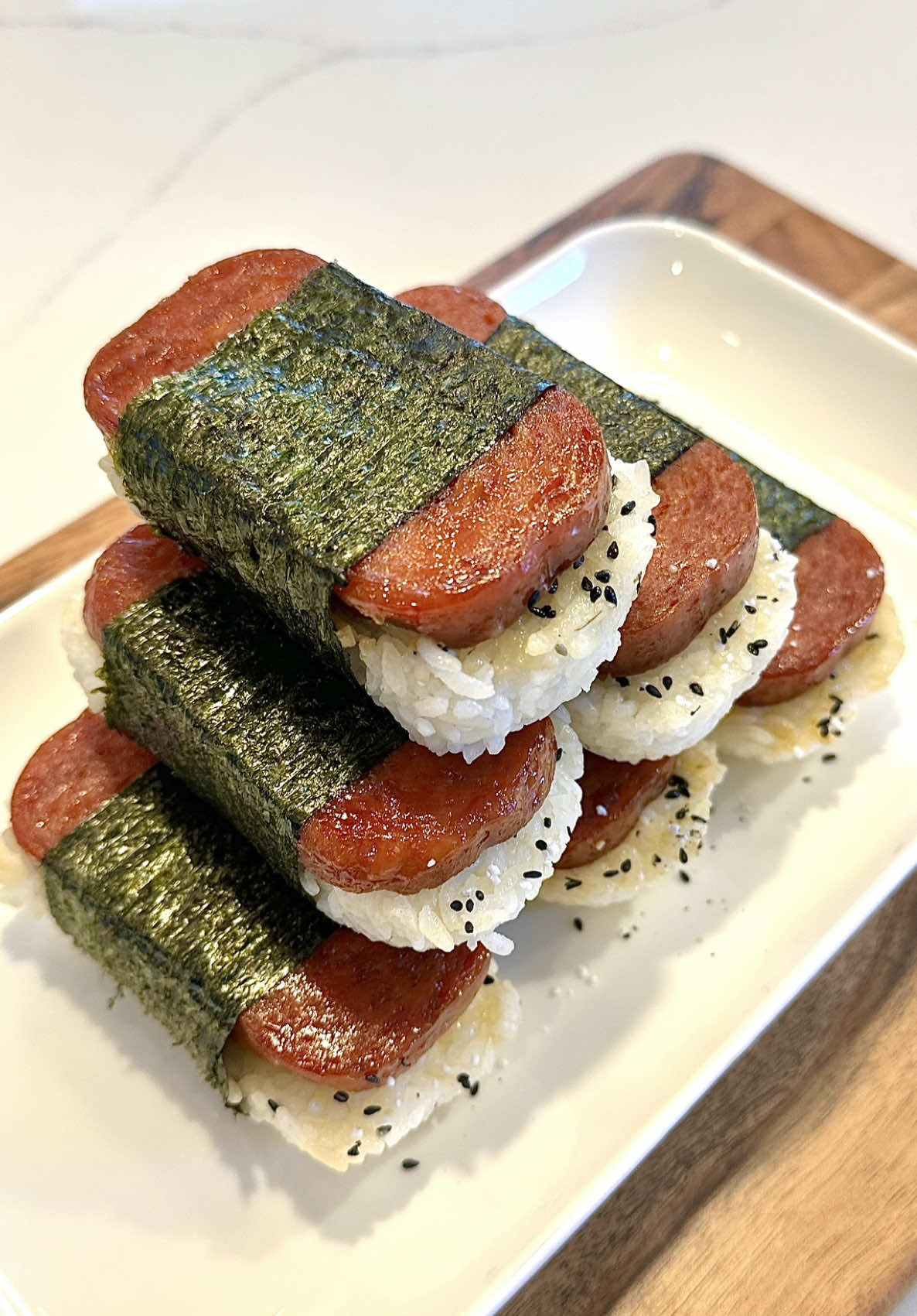 The kids were craving Spam Musubi so I made these delicious Spam Musubis at home! So delicious and easy to make! This recipe is perfect for a quick and tasty dinner! It’s great for any day of the week or when you need a 10 minute dinner idea! It is a great snack in under 30 minutes! Ingredients: 1 can @SPAM®️ Brand  - 3 tbsp @Kikkoman USA Soy Sauce - 2 tbsp Mirin - 2 tbsp brown sugar - 2 cups white rice - Furikake #spammusubi #musubi #EasyRecipe #dinner #Recipe