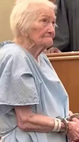 The courtroom fell into a hush when Helen entered. Ninety-one years old. Barely five feet tall. Wearing a hospital gown that swallowed her frame. Her wrists—shackled. Her hands—shaking. To anyone else, she looked like someone’s grandmother who should have been resting in a warm living room, not standing under the cold gaze of fluorescent lights. Judge Marcus scanned the file in front of him: Felony theft. Then he looked up at Helen. And something inside him twisted. For 65 years, Helen and her husband, George, had lived an unremarkable life—the kind built from small routines and quiet loyalty. Each morning, she set out his heart medication. Twelve tiny pills that held back the darkness. But one missed insurance payment changed everything. At the pharmacy, Helen learned that the medicine—normally $50—now cost $940. She froze. Then she walked out empty-handed. Back home, she watched George’s condition decline: His breathing thin and ragged. His hand weak in hers. His life slipping. Three days passed. Three days of helplessness. Three days of watching the person she loved most suffer. So she did the only thing love, fear, and desperation could teach her to do. She went back to the pharmacy. And when the pharmacist turned his back, she slid the pills into her purse. She didn’t make it two steps before alarms screamed. The officers came. At the station, Helen’s blood pressure spiked so dangerously they rushed her to the hospital. And now here she was—still wearing the gown—standing before the law like a criminal. Her voice trembled. “I never thought I’d see a day like this, Your Honor.” Judge Marcus stared at her for a long moment. Then— “Bailiff,” he said quietly, “remove those chains.” The metallic click echoed through the room like a gunshot. He turned to the prosecutor. “Felony charges? For this?” Helen broke. The tears came all at once. “He couldn’t breathe,” she choked out. “I didn’t know what else to do.” The judge’s voice rose—not in anger, but in something deeper. “This is not a criminal. This is a failure of the system—our system.” He dismissed every charge. On the spot. Then he stood. “Mrs. Miller will not be billed for her hospital stay. Her husband will receive his medication today. Not tomorrow. Today.” He ordered social workers and medical teams to their home immediately. Reporters cornered him later. “What made you decide so quickly, Judge?” He didn’t hesitate. “Justice is not just the letter of the law. It is the ability to recognize humanity.” Then he paused. “That woman didn’t steal pills. She fought for her husband's life. And love is not a crime.”