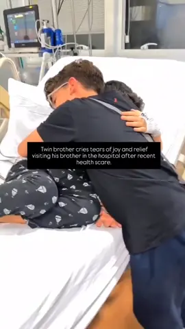 Twin brother cries tears of joy and relief visiting his brother in the hospital after recent health scare.