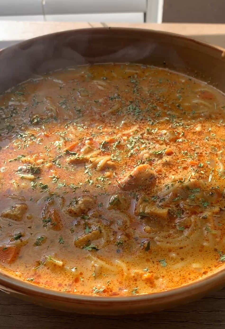 🥣 Classic Chicken Noodle Soup with Creamy Broth! Ingredients 3 chicken breasts 2 tbsp olive oil 3 tbsp butter 1 medium onion, chopped 2 carrots, diced 1 small potato, diced 3 garlic cloves, minced 2 tbsp flour 6 cups chicken broth 1 cup vermicelli noodles 1 cup cream 1 tsp paprika 1 tsp black pepper 1 tsp cumin 1 tsp dry herbs (Italian blend or thyme/oregano) 1 tsp salt Fresh parsley for garnish Instructions 1. In a bowl, season the chicken breasts with paprika, pepper, cumin, dry herbs, and salt (1 teaspoon each). 2. Heat olive oil in a large pot over medium heat. Add the chicken breasts and sear until golden and cooked through. Remove and set aside to cool slightly. 3. In the same pot, melt 3 tablespoons of butter. Add the onion, carrots, potato, and garlic. Sauté until soft and fragrant, about 5 minutes. Sprinkle in 2 tablespoons of flour, stirring to coat the veggies and create a light roux. 4. Slowly pour in the chicken broth, stirring to avoid lumps. Dice or shred the cooked chicken and return it to the pot. Simmer for 10–15 minutes to let the flavors blend and the broth thicken slightly. 5. Stir in 1 cup of vermicelli noodles and cook until tender. Then pour in the cream and mix well. 6. Finish & Serve. Taste and adjust seasoning if needed. Garnish with fresh parsley, and serve warm. #EasyRecipes #quickrecipes #soupseason #fyppppppppppppppppppppppp #chickennoodlesoup 