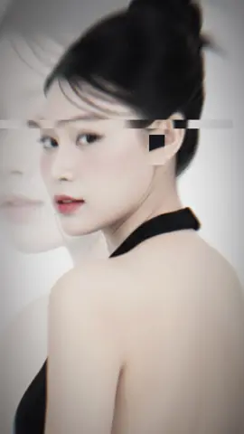 #capcut #gemini #lệnh @Jinnie | Studio AI: Create a double exposure portrait of a woman in a striking, artistic composition that merges two distinct yet harmonious images into one ethereal vision. In the foreground, there is the silhouette of a woman with jet-black, wavy hair pulled back into a messy bun — her face turned slightly away from the camera, lips parted in a soft, contemplative expression. She wears a minimalist black halter top with a deep, open back, revealing her bare shoulders and elongated neck. A delicate silver ear cuff adorns her left ear, catching the light with a subtle gleam. Her posture is balanced and elegant — arms relaxed, body gracefully angled, as if caught between motion and calm stillness. The lighting is soft and directional, casting gentle shadows that accentuate the contours of her jawline, collarbone, and spine. Overlaid on this figure is a larger, translucent close-up of her face — a dreamlike projection dominating the right side of the composition. This second image shows her with eyes closed, long, defined eyelashes, and slightly parted lips that glisten with a natural sheen. Her skin appears flawless, dewy, and radiant, illuminated by soft, diffused light that enhances her luminous texture. One hand gently touches her lower lip, adding a sense of intimacy and vulnerability. The background is a soft gradient from white to gray, appearing almost empty, allowing the layered figures to stand out with clarity and emotional depth. The contrast between the sharp silhouette and the blurred, glowing face creates a surreal, introspective atmosphere — blurring the line between reality and the inner self. don't change her face