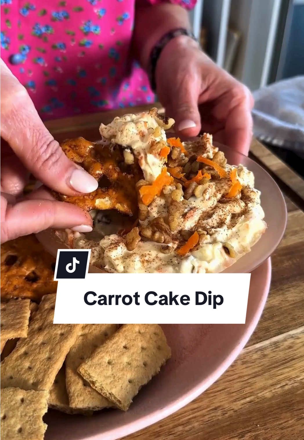 Nothing makes us hoppier than Carrot Cake Dip! 🥕🍰 We're calling it now: you're going to LOVE this dip! Pair with pretzels, graham crackers, and sliced apples for the perfect spring snack. Be sure to continue reading or click the link in the @allrecipes bio for the full recipe! 🔗 Ingredients: 2 carrots, peeled and grated 1 tablespoon butter 1/4 teaspoon kosher salt 1/4 cup brown sugar 16 ounces cream cheese, softened 1 teaspoon vanilla extract 1 cup confectioners sugar 1/2 teaspoon ground cinnamon 1/4 teaspoon ground ginger 1/8 teaspoon ground nutmeg 8 ounces crushed pineapple, well drained 1/2 cup chopped toasted walnuts, plus more for garnish if desired Directions: Heat butter in a small skillet over medium-high heat. Add carrots and salt and cook 1 minute.  Add brown sugar and cook until sugar dissolves, about 1 minute more. Remove from heat and drain on paper towels. Combine cream cheese, vanilla, confectioner’s sugar, cinnamon, ginger, and nutmeg in a large bowl. Beat with an electric mixer until smooth and slightly fluffy. Fold in reserved carrot mixture, pineapple and walnuts until well combined.  Cover and refrigerate 1 hour or until ready to serve. Top with additional walnuts and cinnamon if desired. 🧑‍🍳: @NicoleMcLaughlin  #carrotcake #carrots #carrotrecipes #spring #springsnacks      