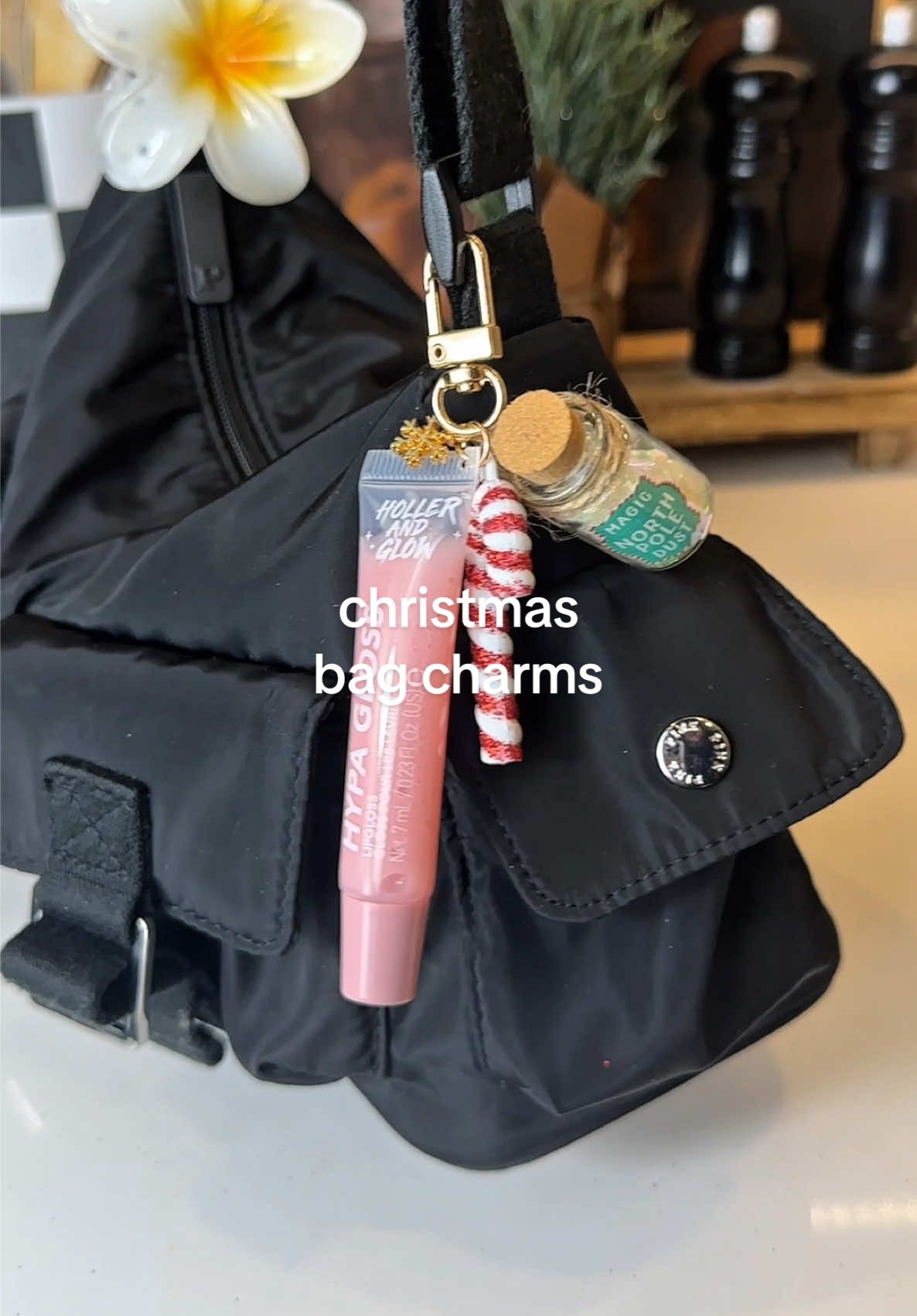 Easy $5 Christmas bag charms!!  Grab some lip gloss keychains and mini ornaments at Walmart or Target and then use pliers to open the hooks, add on your charms and you have the cutest holiday bag charms!  #giftidea #christmas #christmasgiftideas #diycraft #diygift 