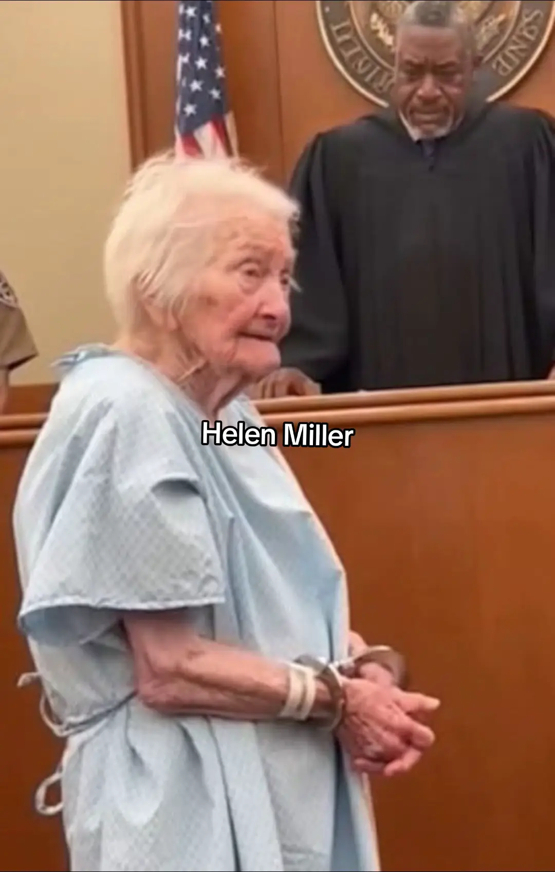 The courtroom fell into a hush when Helen entered. Ninety-one years old. Barely five feet tall. Wearing a hospital gown that swallowed her frame. Her wrists — shackled. Her hands — shaking. To anyone else, she looked like someone’s grandmother — someone who should’ve been resting in a warm living room, not standing under the cold glare of fluorescent lights. Judge Marcus glanced at the file in front of him: Felony theft. Then he looked up at Helen. And something inside him twisted. For sixty-five years, Helen and her husband, George, had lived an unremarkable life — the kind built from small routines and quiet loyalty. Each morning, she set out his heart medication: twelve tiny pills that kept the darkness away. But one missed insurance payment changed everything. At the pharmacy, Helen learned that the medicine — normally $50 — now cost $940. She froze. Then she walked out empty-handed. Back home, she watched George’s condition decline: His breathing thin and ragged. His hand weak in hers. His life slipping away. Three days passed. Three days of helplessness. Three days of watching the man she loved most suffer. So she did the only thing love, fear, and desperation could teach her to do. She went back to the pharmacy. And when the pharmacist turned his back, she slipped the pills into her purse. She didn’t make it two steps before the alarms screamed. The officers came. At the station, Helen’s blood pressure spiked so dangerously that they rushed her to the hospital. And now, here she was — still wearing that gown — standing before the law like a criminal. Her voice trembled. “I never thought I’d see a day like this, Your Honor.” Judge Marcus stared at her for a long moment. Then he said quietly, “Bailiff, remove those chains.” The metallic click echoed through the room like a gunshot. He turned to the prosecutor. “Felony charges? For this?” Helen broke. The tears came all at once. “He couldn’t breathe,” she choked out. “I didn’t know what else to do.” The judge’s voice rose — not in anger, but in something deeper. “This is not a criminal. This is a failure of the system — our system.” He dismissed every charge. On the spot. Then he stood. “Mrs. Miller will not be billed for her hospital stay. Her husband will receive his medication today — not tomorrow. Today.” He ordered social workers and medical teams to their home immediately. Later, reporters cornered him. “What made you decide so quickly, Judge?” He didn’t hesitate. “Justice is not just the letter of the law,” he said. “It’s the ability to recognize humanity.” Then he paused. “That woman didn’t steal pills — she fought for her husband’s life. And love is not a crime.” All rights and credits to the original creator  -Reece Ryan. #helenmiller #fyp #fyppppppppppppppppppppppp #fpyシ #helen 