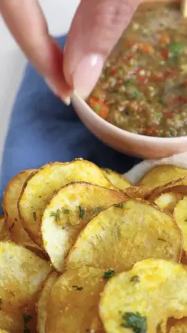 Maru Bhajiya + Chutney 🥔 🍅 🌶️  So often we struggle to find the origins of a dish but this iconic snack has a story of migration, invention, & adaptation, just as many of our families do.  If you’d like a printable recipe, comment “Kenya” and I’ll send you a direct link, otherwise here’s what you need to make it: for the bhajiya gather // 2 large white potatoes; cut into ⅛ inch thin disks  1 tbsn grated ginger ¼ cup chickpea flour/besan 1 tbsn chopped green chilies 1 tsp haldi/turmeric powder 3 tbsn chopped cilantro 2 tbsn rice flour; finely ground 1½ tsp salt; adjust to taste 1 tsp paprika or deghi mirch(optional, I really love the sweet smokiness this lends and the hint of color) neutral oil to fry make // Wash and thinly slice the potatoes using a mandolin or sharp knife, no more than ⅛ inch thick. Pat dry the potatoes and spread out on a large plate. In a bowl mix the salt, ginger, chillies, chili powder, turmeric, ajwain, cilantro, besan and rice flour. Spread on all the potatoes, front and back. Let rest for 15 minutes. As the potatoes rest their waters will release and there will be enough moisture that will help to form a thin coating enough for the batter to stick. Heat oil in a kadai and carefully add slice by slice to the hot oil. Fry until the bhajias are crispy and golden, turning in between using a slotted spoon. Place hot fried bhajiyas on a paper towel to soak up and excess oil.  for the chutney gather // 1/2 cup cucumber; chopped 1/2 cup tomatoes; chopped  1/3 cup carrots; chopped 3 tbsp cilantro; leaves + stalks; chopped 2 green chilies; chopped 1 tbsp lemon juice 1 tsp ginger; grated  1/2 tsp sugar 1/4 tsp jeera powder 1 tsp salt; adjust to taste make // In a blender, pulse all the ingredients to a salsa/rough chutney. Chill in an airtight container until ready to use. 