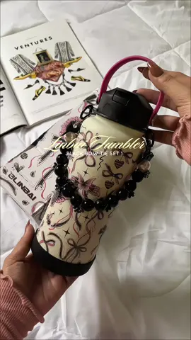 this linbai tumbler comes with a beaded handle and heart bow pendant for a super cute, accessorized look. the black bow and pink design make it stand out effortlessly. double-walled and insulated, it keeps your drinks cold or hot for hours. #tumbler #linbaitumbler #linbaiflask #linbaiaccessories #tumblerrecommendations 