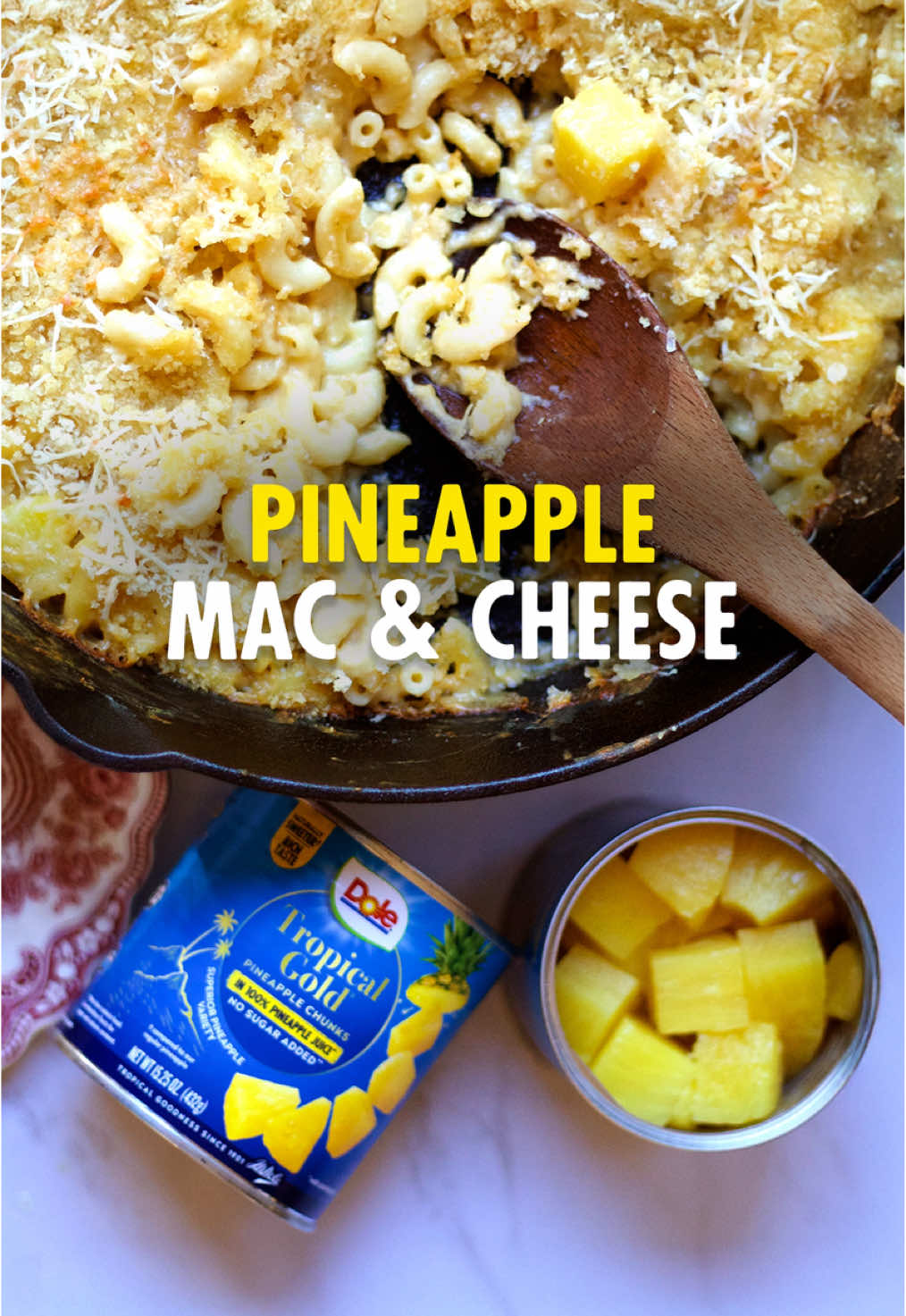 Mac & cheese just got a sunshine twist. Your entire family will be talking about it for months. Serves 6–8 Ingredients 1 lb elbow macaroni, cooked al dente 4 Tbsp butter ¼ cup flour 4 cups milk 4 cups shredded cheddar cheese (mix with Gruyère if desired) 1 cup Dole® Tropical Gold Pineapple Chunks (roughly chopped), drained and patted dry 1 cup panko breadcrumbs 2 Tbsp grated parmesan 1 Tbsp olive oil or melted butter Pinch smoked paprika #thanksgivingrecipes  #sidedish #friendsgiving #macandcheese #pineapplerecipe 