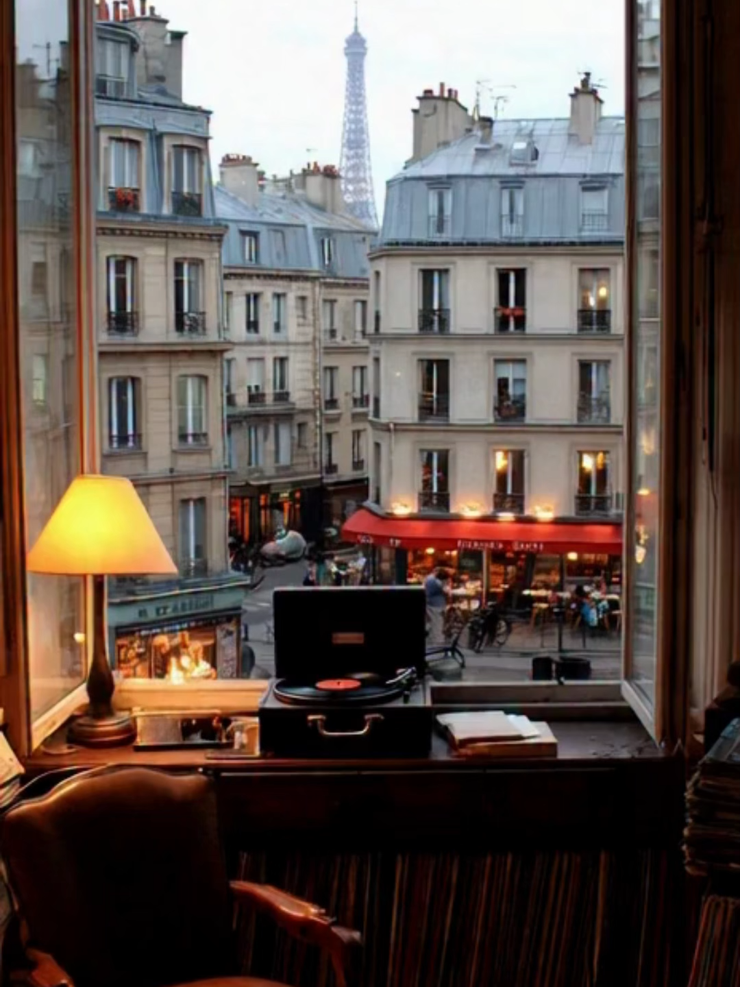 Parisian Loft Rainy Afternoon – Soft Jazz Mood Vintage record player spinning softly while rain slides down a large window overlooking Haussmann rooftops and a misty Eiffel Tower. #ParisAesthetic #RainyDayVibes #LoFiAmbience #ParisLoft #SoftJazzMood