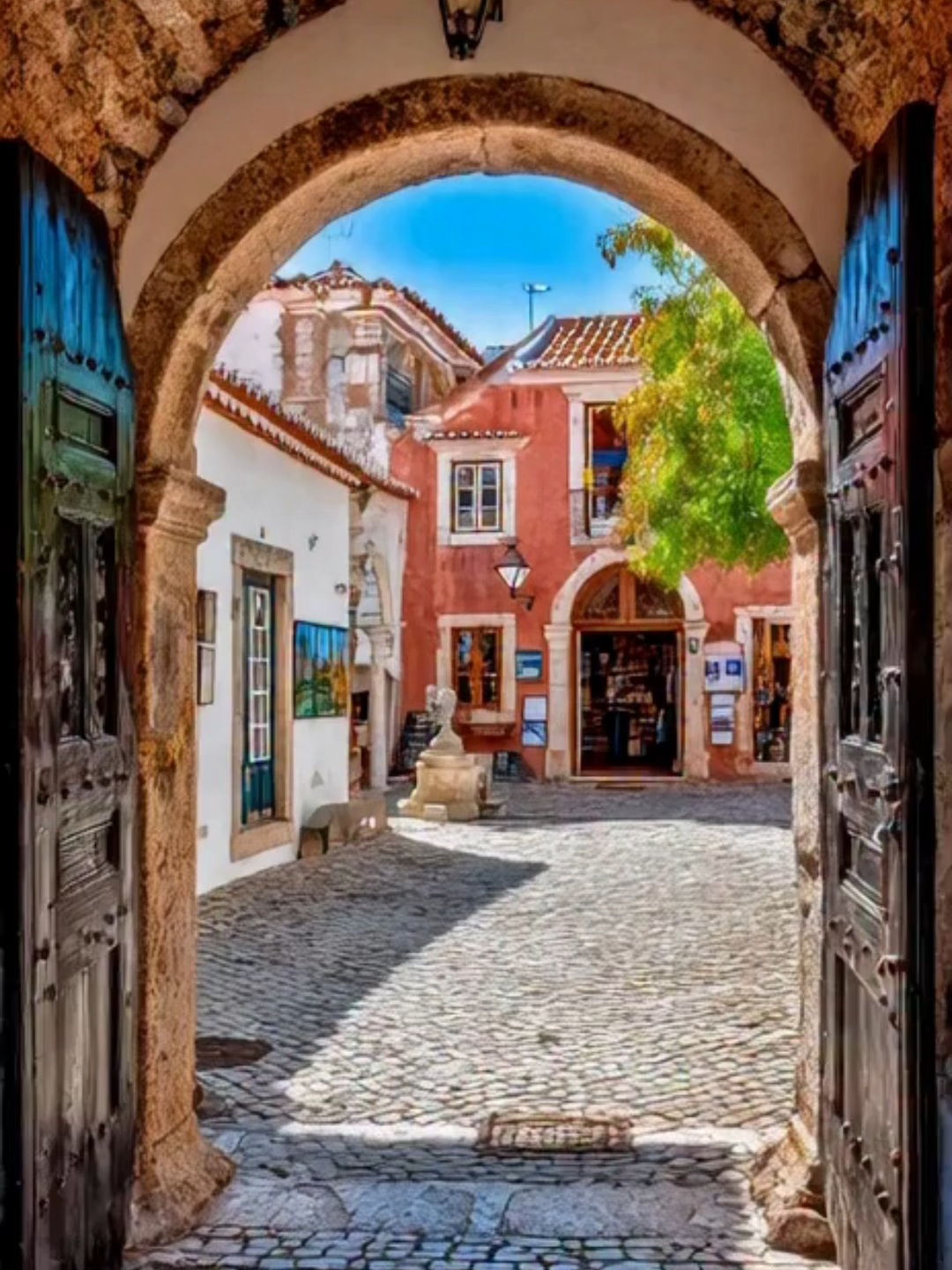 Portuguese Mazagão House – Sunny Blue Tiles A bright Portuguese courtyard filled with shimmering azulejo blue tiles, warm sunlight reflecting across the walls, a lemon tree casting soft moving shadows, and the gentle sound of a guitar creating a calm Mediterranean mood. A peaceful, sun-soaked moment inspired by classic Mazagão architecture. #PortugalAesthetic #Azulejos #MediterraneanVibes #TravelInspiration #CasaPortuguesa