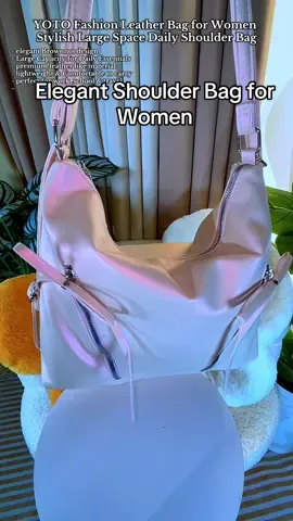 Stylish and elegant pink shoulder bag with a brownnot design made from premium leather like material feature a large capacity interior perfect for daily essentials, work , travel , or school. Versatile, lightweight, and perfect for Modern women. #pinkbag #womenbag #shoulderbag #handbag #fashionbag 