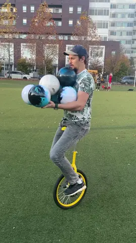 Most bowling balls held simultaneously while riding a unicycle 🎳 6 by Ishtar Chandaria 🇨🇦