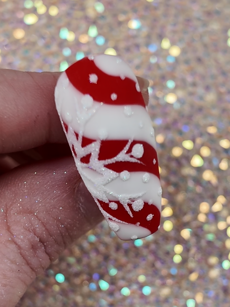 Cute candy cane nails design with a sugared snowflake. #nailtech #nailinspo #nailtutorial #nails #naildesigns 