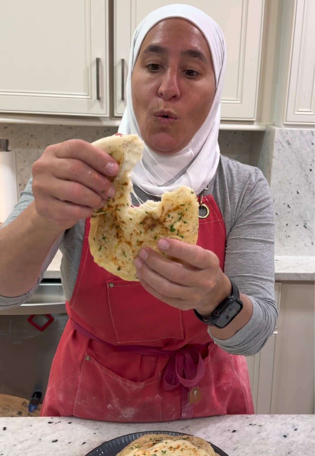 Cheese stuffed Garlic Naan Ingredients For the dough: 	•	3 1/2 cups all-purpose flour 	•	1 1/2 cups warm water 	•	1 teaspoon yeast 	•	1 teaspoon salt 	•	1 tablespoon extra virgin olive oil      •.    1 cup mozzarella shredded                     cheese For the garlic topping: 	•	¼ cup olive oil 	•	3 cloves garlic, smashed 	•	⅛ cup chopped parsley or cilantro ⸻ Instructions 	1.	Activate the yeast: In a large bowl, combine warm water and yeast. Let it sit for about 5 minutes until the yeast starts to foam. 	2.	Make the dough: Add flour and salt to the yeast mixture. Mix with a spoon at first, then knead by hand or with a mixer for about 5 minutes until a soft dough forms. 	3.	Add the oil: Rub your hands with olive oil and knead the dough a few more times until smooth. 	4.	First rise: Cover the dough with a warm towel and let it rest in a warm place for about 1 hour, or until doubled in size. 	5.	Shape the naan: Once risen, divide the dough into balls. Flatten them out add some of the mozzarella cheese in the middle close it up into a ball. Place them in a warm area again, covered, and let them rise for another 30 minutes. 	6.	Cook the naan: Heat a grill pan or regular pan over medium heat. Lightly oil the surface. Flatten each dough ball with your hands or a rolling pin. Cook each naan for 1–2 minutes per side, or until golden brown spots appear. 	7.	Make the garlic oil: In a small bowl, mix together olive oil, smashed garlic, and chopped parsley or cilantro. 	8.	Finish: Brush the hot naan with the garlic oil and enjoy immediately! #bread #fyp #fypシ #Recipe #EasyRecipe 