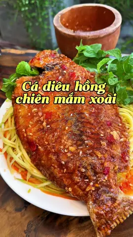 Ngày 23| Cá diêu hồng chiên giòn rụm, chan sốt mắm xoài chua ngọt cực cuốn!😋 Lớp da vàng giòn, thịt cá mềm ngọt tự nhiên, hòa cùng sốt xoài thơm nức mũi. Món này ăn với cơm hay làm món nhậu đều mê chữ ê kéo dài.#cadieuhong #amthuctiktok #nauancungtiktok #monngonmoingay #xuhuongtiktok 
