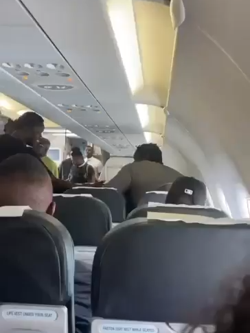 The moment a fight broke out between VeryDarkMan and Mr. Jollof in an aircraft.   They both risk a lengthy flight ban.