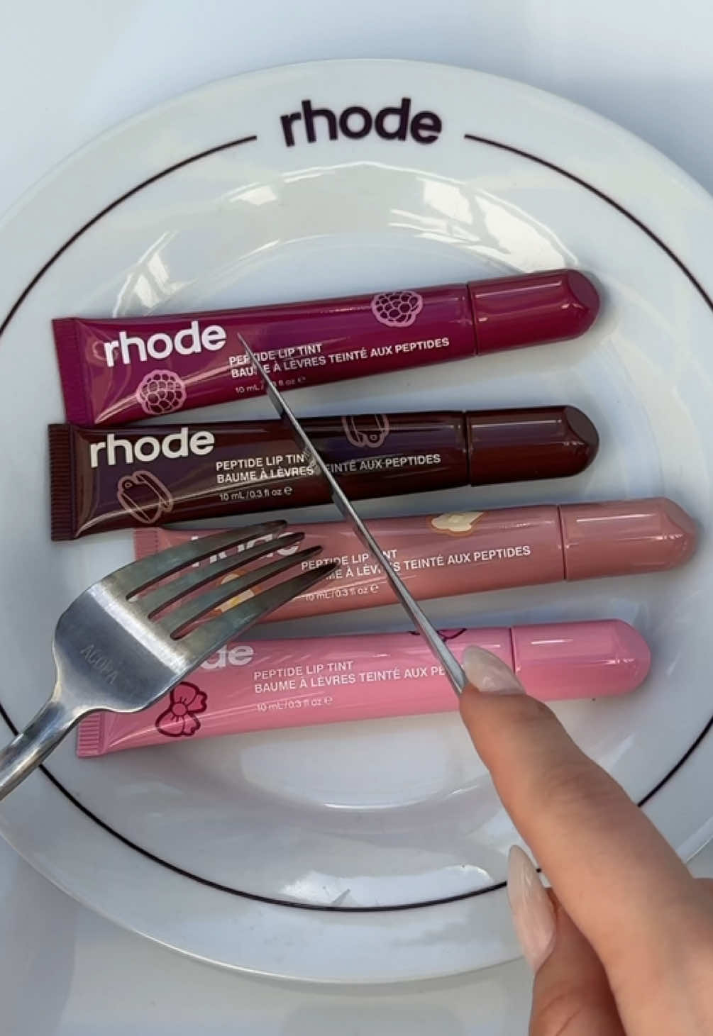 a sweet twist on the classic shades. scented peptide lip tints available now at rhodeskin.com 🖤