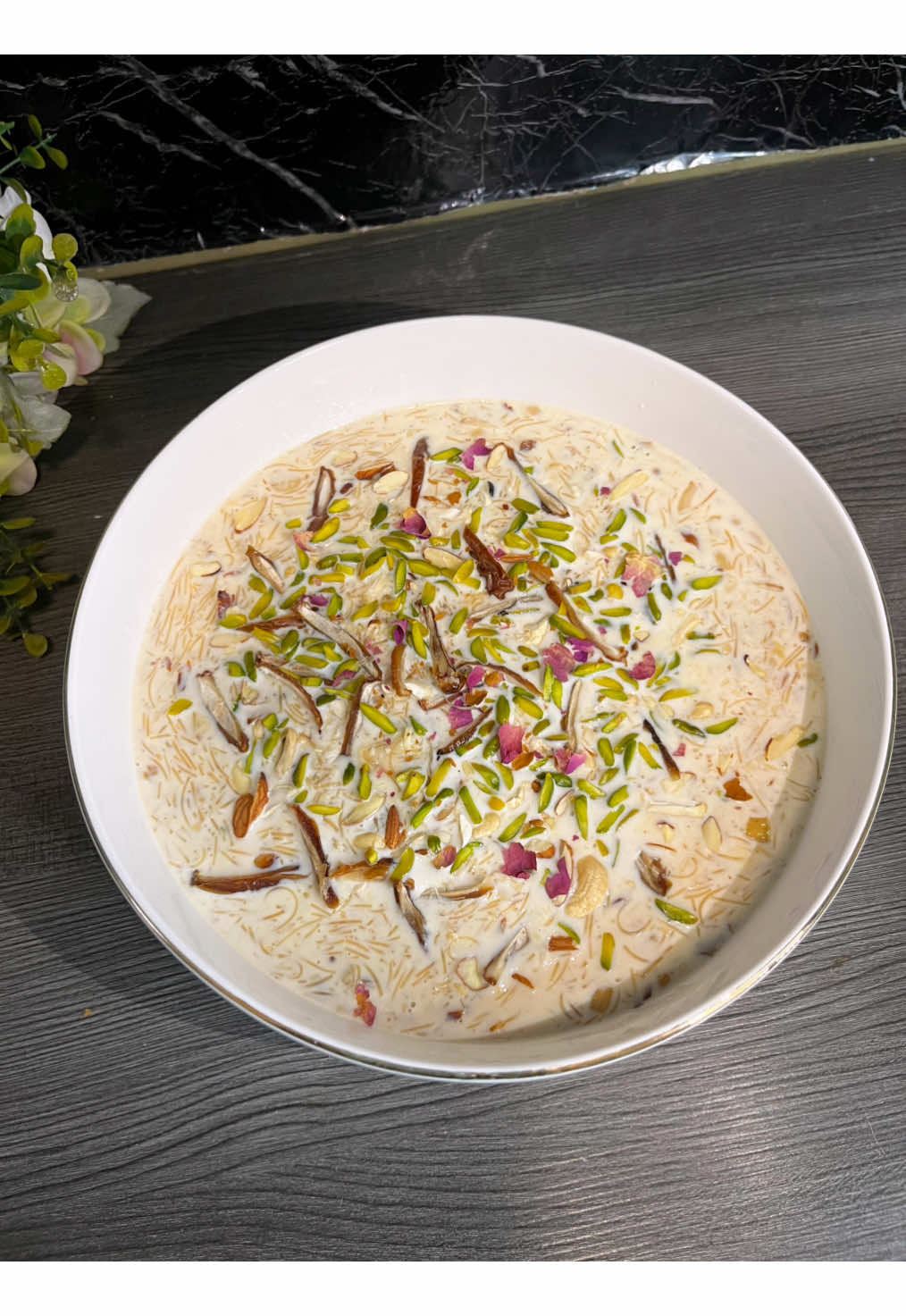 sheer khurma recipe|| د شیرخرما جوړولو طریقه ingredients: - 2 to 3 tbls butter or ghee - 3 to 4 tbls chopped chashew - 3 to 4 tbls chopped almond - 8 sliced dates - 1cup roasted vermicelli - 1liter milk -3 tbls sugar - ½ tsp cardamom powder - 2 tbls sweetend condensed milk - 1 tbls kewra water garnish with dried nuts, dates and rose petals  #sheerkhurma #vermicelli #dessert #EasyRecipe #foryou 