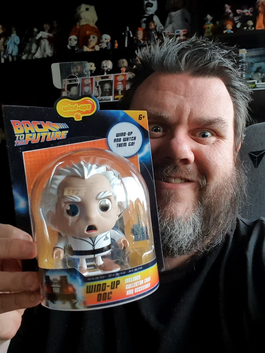 Lets Go BACK TO THE FUTURE!!! With New Toy Wind-Upz!!! Great Scott! Officially licensed walking Wind-Upz™ Doc collectable toy comes to life with the turn of the retro Wind-Upz™ branded key. Complete with hand-held remote control accessory, motion arms, vinyl moulded turnable head and exclusive foil character card. Is Doc heading 