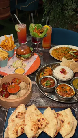 📍 Chai Green, Stratford Rd 🍔🥟 {INVITE} Rating: 8.5/10    We had the opportunity to try some of Chai Greens popular products and some brand new menu items. 🍔 ☕️ ✨10% DISCOUNT CODE : chaigreen10✨ *instore only* We’d definitely recommend the new signature burger for the meaty lovers. 🍔 The pulled beef was full of juice and flavours. It also has some nice thick pickles 🥒 inside which we loveee 😍  They also have a new terrys 🍊hot chocolate available perfect for some cosy vibes in this weather. ☕️ The thali is perfect if u can’t decide what u want. From chaat bombs, poppadoms, curries, gulab Jamun and more😍. That’s starter, main and dessert all covered in one! Not only is the variety amazing but the food itself was delicious so it’s a win-win.🏆  We got steamed and schezuan chicken momos. 🥟 There s have got a little kick 🔥 to them but have it with the sauce and it’s perfect. The dynamite chicken had the best dynamite flavour we just wished the actual chicken inside itself was bigger. 🍗 The stir fry has a strong sweet chili 🌶️flavour, so bare that in mind before ordering. We thought it was okay but a bit basic compared to the rest of the food we enjoyed.  Be sure to leave room for desserts and definitely try the chocolatey 🍫 goodness Matilda cake 🍰 or the fluffy French toast! 🍞🫐. They were a perfect treat to end the night for us sweet 🍬 tooth lovers. What we got: 	⁃    Prawn stir fry (£14.95) 	⁃    Steamed chicken momos (£9.95) 	⁃    Chai green thali (£25.00) 	⁃    Signature burger (£6.99) 	⁃    Dynamite chicken (£7.95) 	⁃    Terries hot chocolate (£4.45) 	⁃    Matilda cake (£8.25) 	⁃    French toast (£8.95) 	⁃    Mocktails (£6.99) Thank you so much @ChaiGreen for having us! 🔔 Follow us for more halal reviews! ………………………. #stratfordroadbirmingham #halalfoodbirmingham #fyp #desi #brunch                 