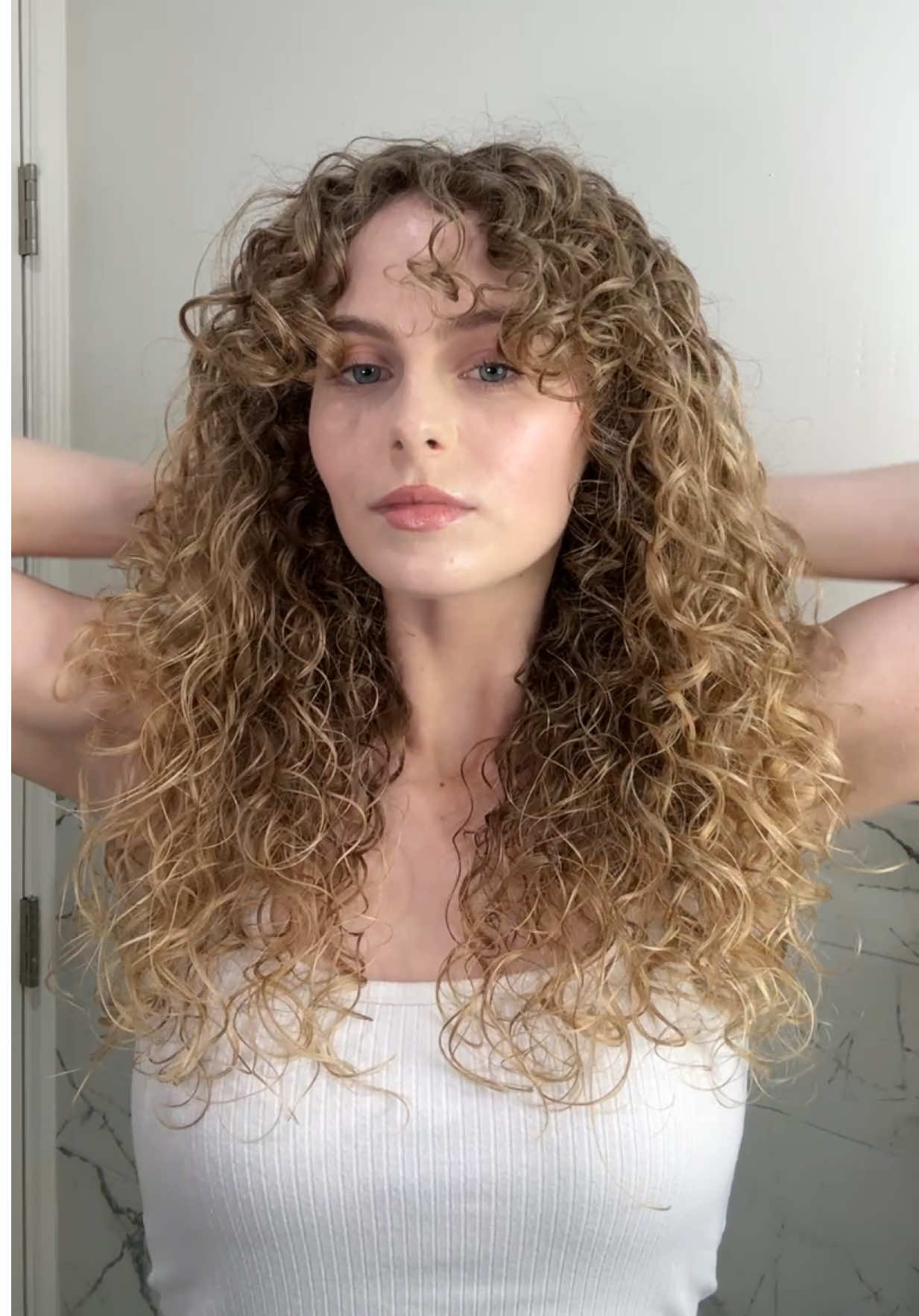 WHAT I’VE LEARNED 👇 💗 trims every 4 months - do as I say, NOT as I do 🫣 I used to trim my hair almost daily (myself!!!) at the beginning of my curl journey! It ended up being sooo short but so cute (buttttt uneven. There is a way to trim DIY without making it uneven! I just hadn’t learnt that yet. So every time I saw a stringy piece or an uneven piece, I would chop regardless of where I was at in my wash day cycle. But good things require patience)! Now, I’m TRYING to get my hair trimmed every 4 months - yes, even though I’m trying to grow it out - and now that I’m not DIYing my curl cuts, it’s VERY hard to stay consistent. In an ideal world, I would be trimming every 4 months to keep my ends healthy and help my hair grow longer in the long run (so I don’t have to cut off so much and get an ACTUAL haircut) 💗 figuring out the ROOT cause of the damage - in my case, it was heat damage from daily straightening and sun damage from doing sports outdoors (crazy that the sun can damage your hair so much. Since my hair is fine and blonde, it lacks the structure and melanin to protect it. You can tell my hair is healthier now and I don’t spend as much time in the sun, because it’s darker now. The sun works the opposite way in hair vs skin, because your hair doesn’t make melanin in response to sun - the sun breaks down the hair’s natural melanin! I’m also much paler now too 🤣). So my solution was STOPPING heat-styling (my transition period included blow-drying after showers, braiding, buns etc. until I was ready for my curl journey), and spending less time in the sun. You can also use heat protectants and UV protectants, but they don’t protect against 100% of damage, so be warned. 💗 bond builders, protein treatments, hair masks, leave-ins & oils - these are all so important in protecting your hair! Let me break it down for you:  - Bond builders, protein treatments, & hair masks: bond builders (and molecular hair repair products) temporarily repair damage that’s already been done, by fixing the hair’s natural chemical bonds that have been broken. Protein treatments restore the hair’s protein (hair loses protein when it gets damaged) - protein loss happens a lot, so this is temporary too. Hair masks temporarily restore the hair’s moisture. All 3 of these are needed when your hair gets damaged for optimal repair. There are different types of bond builders and molecular repair treatments for different types of bonds, so one treatment may not fix all types of bonds - but it’s better to start with one than use none at all! - Leave-in conditioners and oils: leave-in conditioners are good at conditioning your hair, which helps reduce frizz and protect your hair from the environment. They also help restore your hair’s pH balance, which is essential. Btw, hair masks and acidic bonding treatments also restore your hair’s pH balance, but it’s recommended to also use a leave-in conditioner. Hair oils help give your hair added protection from the environment. I like using lightweight oils like squalane (with an A) Above all, patience is so important in your hair journey! Especially if you don’t want to chop all your hair off. My hair journey was easier because I spent about a year being “lazy” with my hair instead of straightening it, and just blow dried and braided it, which was wayyy less damaging. So I had about a year’s worth of healthy hair already grown in, and that helped me realize I had curls. Then I slowly chopped more and more of my hair off until it was a cute little bob, and that worked for me for a while! But if you’re not ready for that, you’ve gotta be ready for the fact that your hair will not transform overnight if it’s damaged. Braids and low-heat blowouts can help so much during that time ❤️ Feel free to follow if this helped you! And if you need product recs, leave a comment or check out my Amazon storefront! I have tons of amazing products on there 🫶 #camrynscurls #curly #curlyhairjourney #damagedcurls #curlyhairtips 