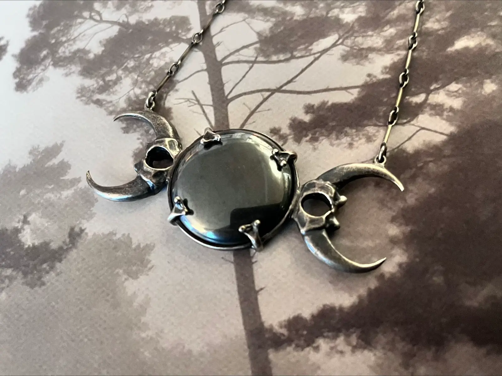 Bloodmilk Jewels Limited Hematite and Sterling Silver High Priestess necklace.  Asking what I paid, $415 USD ($580 CAD). Paypent via PayPal or purchase thriugh my Depop shop. Will ship internationally as I’m located in Canada.  Chain length: 14” Pendant width: 2.5” Pendant height: 1”