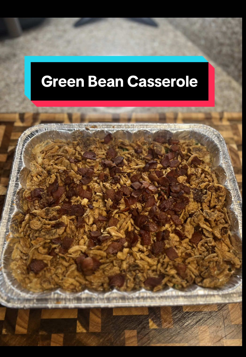 Thanksgiving Side Series Part ll: Green Bean Casserole! Ingredients: Fresh Green Beans - 2lbs Onion - 1 Mushrooms - 10oz Bacon - 1/2lb Butter - 4tbsp Salt  Pepper Italian Seasoning  Worcestershire  Flour - 4tbsp Chicken Broth - 1c Half & Half - 1 pint Parmesan - 1/2c Lemon Juice Crispy Fried Onions - 12oz Directions: 1. Start by blanching the green beans. Add the fresh green beans to a pot of boiling water. Boil for 3-5mins until softened. Remove and place in a bowl of ice water to stop cooking. Set aside.  2. Add half a pack of diced bacon to a pot and render on medium low heat until starting to get crispy.  3. While the bacon renders dice one onion and slice the mushrooms.  4. Remove the bacon and add in the butter to the pot. Cooking for 3-5mins and then add in the mushrooms. Season with salt, pepper, Italian seasoning and a couple splashes of Worcestershire sauce.  5. Cook for 8-10mins on medium until the mushrooms are softened and release some of their liquid. Add in the flour a little bit at a time making sure to mix and cook out the raw flour.  6. Pour in 1c of chicken broth a little at a time mixing constantly. Once all the broth is mixed in add the half & half a little at a time as well.  7. Pour in some shredded parm and give it a taste to adjust your seasoning. I ended up adding a pinch of everything, but as always it’s to your taste. Finish with a light squeeze of lemon juice.  8. Pour the mushroom soup over the green beans in tray and mix in about half a 6oz container of crispy fried onions. Top the casserole with the rest of the onions and your crispy bacon pieces.  9. Bake at 350 for 30-40mins until the onions are nice and crispy. Allow to set for 10mins after taking out of the oven before serving. Enjoy! #greenbeancasserole #thanksgiving #thanksgivingdinner #thanksgivingsides #thanksgivingfood 