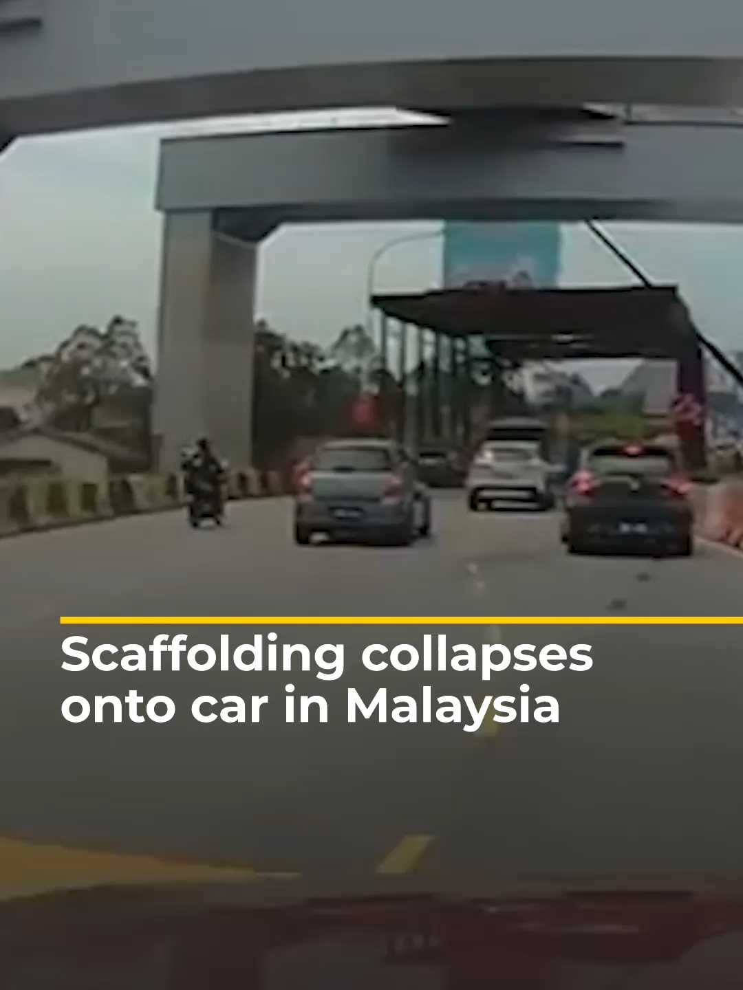 Construction scaffolding collapsed onto a car in Kuala Lumpur, Malaysia, trapping the female driver inside until members of the public pulled her to safety. #news