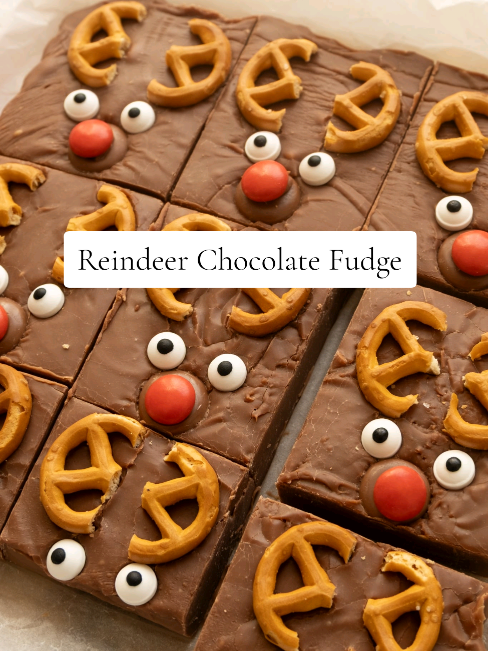 🦌Reindeer Chocolate Fudge🦌YES PLEASE! Recipe below 👇🏻 So easy to make, perfect for making with kids too. It's so simple but delicious and mega cute. It would make the sweetest (pun intended) gift too.  397g tin of condensed milk 400g milk chocolate 18 pretzels(I used gluten free ones), side cut off  18 edible eyes 9 red M&M's 9 small chocolate buttons  In a pan over a gentle heat melt together the condensed milk and chocolate. Pour into a line 8x8 tin. Add the pretzels on top along with the eyes, m&ms and chocolate buttons.  Leave to set in the fridge overnight or for at least 4/5 hours. Slice and enjoy. I would slice these slices again for serving. But leave whole for gifting.  #christmasbaking #baketok #christmasfood #chocolatefudge 
