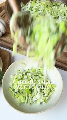This salad may look incredibly simple, but that’s exactly why it’s so delicious. The freshness of the cabbage and iceberg creates the perfect crunchy base, while the garlic completely transforms the flavor—adding a bold, aromatic kick that makes this humble salad unforgettable. Ingredients • 1/4 cabbage, very thinly sliced • 1/2 iceberg lettuce, very thinly sliced • 2 fresh spring onions, sliced • A handful of finely chopped dill • 1–1.5 cloves garlic, smashed into a paste • Extra Virgin Olive oil • White vinegar • Salt Instructions In a large bowl, add the cabbage and iceberg and gently fluff them with your hands. Add the sliced fresh onions and the chopped dill. Add the smashed garlic, a drizzle of olive oil, a splash of white vinegar, and salt. Pour in a bit more extra virgin olive oil and vinegar and toss everything well until evenly coated. Taste and adjust the salt or acidity if needed. Let the salad rest for a few minutes so the flavors blend beautifully—then enjoy! #cabbagesalad #greekcuisine🇬🇷 #mediterraneandiet #alexandrashome #fypシ゚viral 